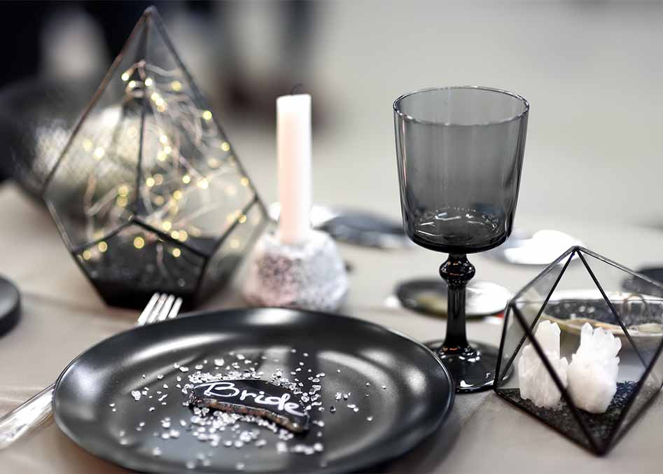 Black wedding table setting and centerpiece.